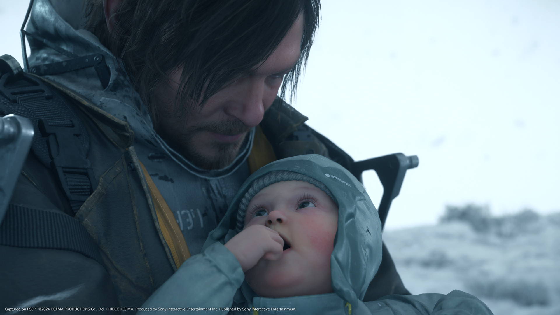 Sam (Norman Reedus) Cradles Baby Lou in close -up in Death Stranding 2