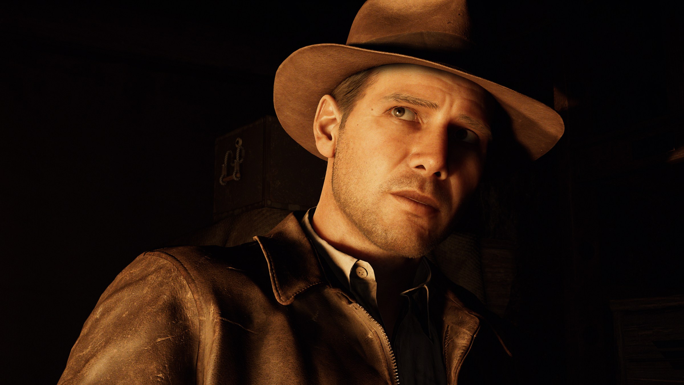 Close -up of Indiana Jones, wearing her typical explorer with brown leather jacket and brown Fedora, lit by Firelight at Indiana Jones and The Great Circle